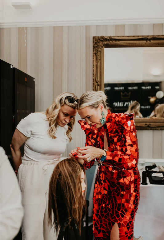 Kelly Maxwell teaching a stylist during Elevate training